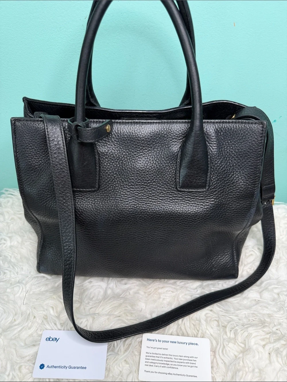 Authentic Prada Black  Leather Satchel with Gold Logo .